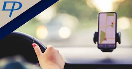 Woman driving with phone GPS